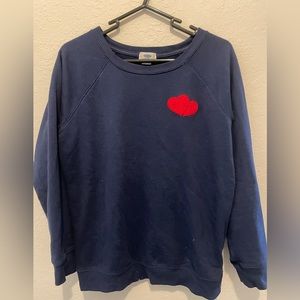 Old navy blue sweater with red heart